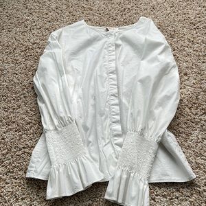 White Ladies’ Blouse with wrist & back ruching detail.